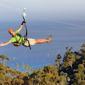 a man standing next to a body of water