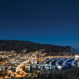 a train is parked on the side of a mountain