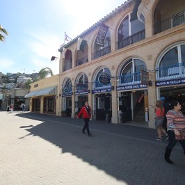 a group of people walking in front of a building