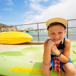 a woman sitting at a beach