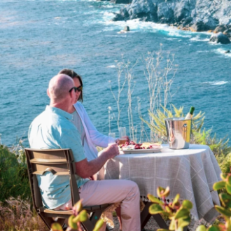a couple of people that are sitting in the water
