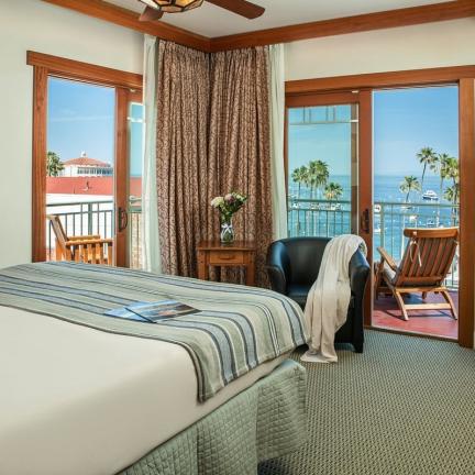 a bedroom with a large bed in a hotel room