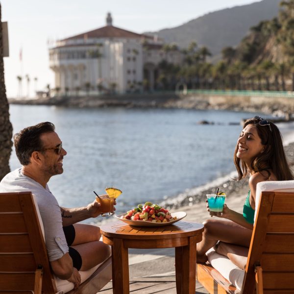 A couple lounging at Descanso Beach Club.
