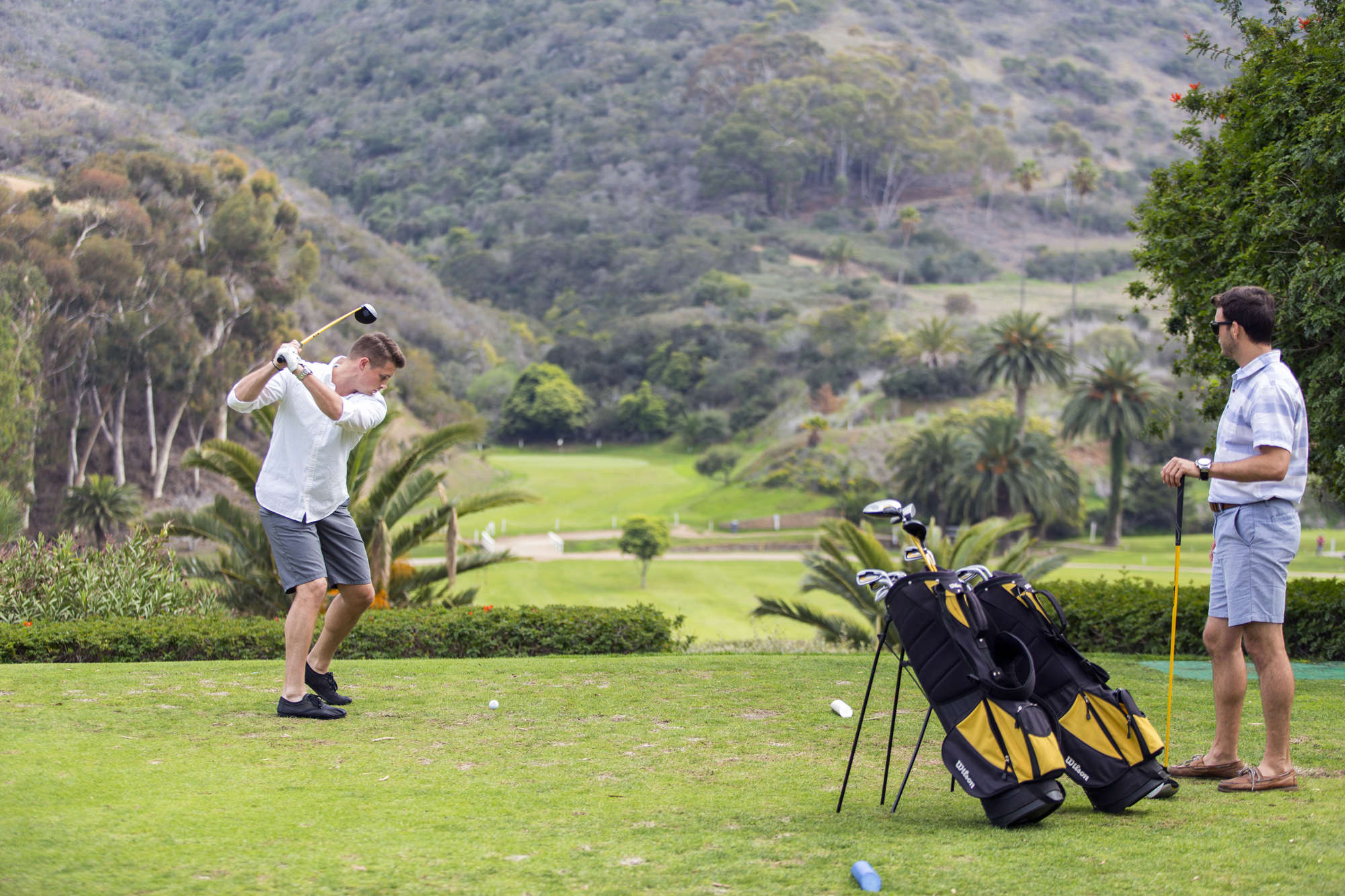 a group of people playing frisbee in a field