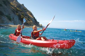 Two young girls kayaking on Catalina Island.