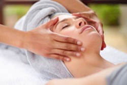 A woman receiving a massage at the spa.