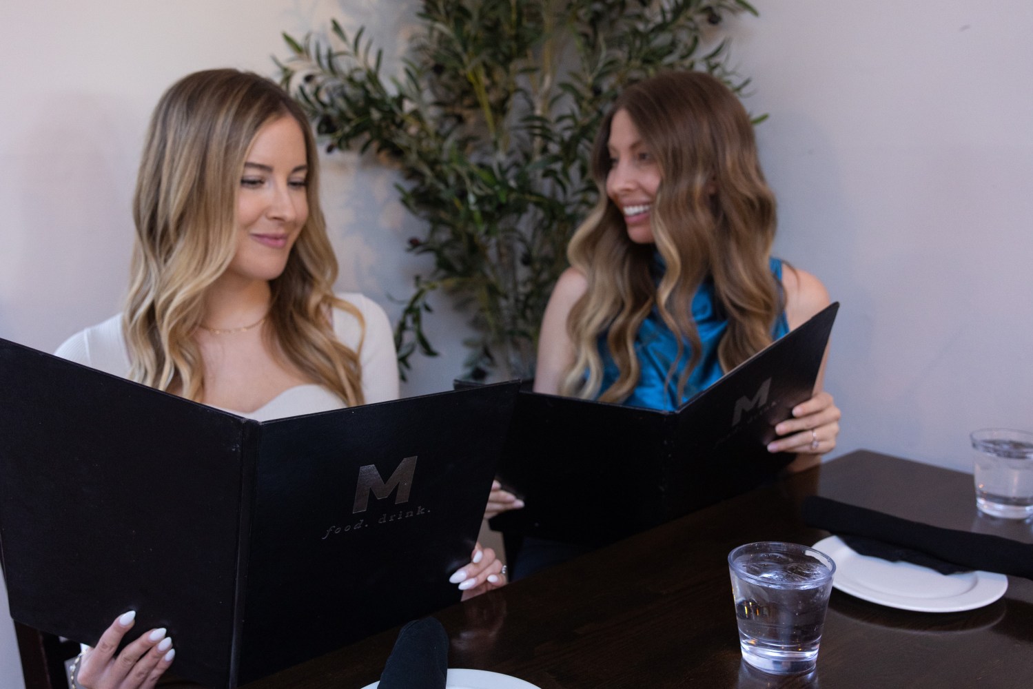 Two girls reading the menu at the M Restaurant. 