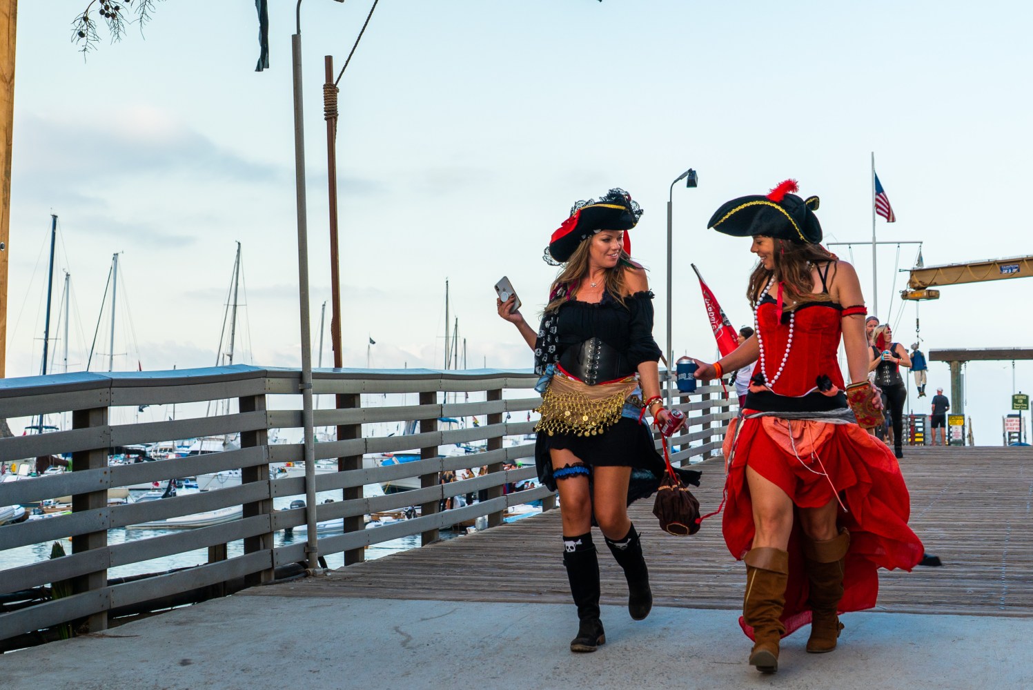 Two girls walking into Buccaneer Days dressed as pirates in Two Harbors. 